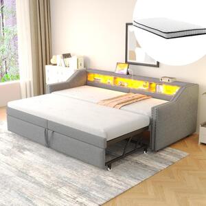 Divano letto 90x200 trasformabile in 180x200, con struttura imbottita in grigio chiaro, dotato di luci LED, prese USB, 3 vani portaoggetti, rete a molle e due materassi a molle