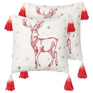 Set di 2 cuscini decorativi in cotone bianco rosso 45 x 45 cm Motivo natalizio Stampa renne Nappe Accessori Decorazione festiva Beliani