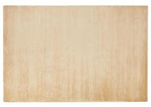 Tappeto in viscosa beige sabbia 140 x 200 cm a pelo corto capitonné moderno Beliani