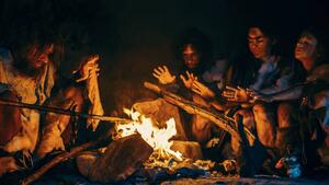 Illustrazione Neanderthal or Homo Sapiens Family Cooking, gorodenkoff