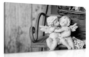 Quadro su tela – Statuette di angioletti sulla panchina in bianco e nero