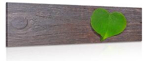 Stampa su tela – Foglia a forma di cuore su sfondo di legno