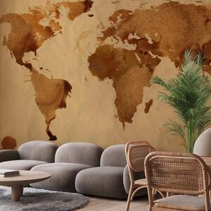 Carta da parati Mondo del caffè - mappa astratta del mondo di macchie su sfondo sabbia