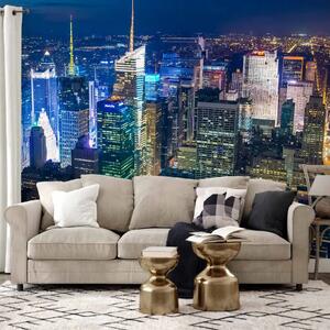 Carta da parati Manhattan di notte - una vista aerea dell'architettura luminosa