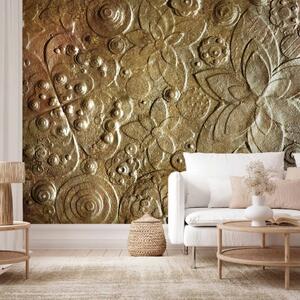 Carta da parati moderna Vorticosità - sfondo con texture di fiori in rilievo nei colori dorato