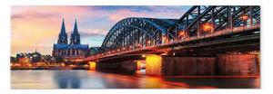 Quadro moderno Colonia, Germania - ponte illuminato al tramonto sulla città