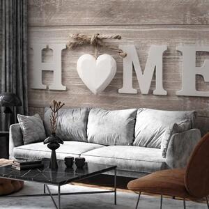 Carta da parati moderna Calore domestico - scritta bianca “Home” con cuore su assi di legno chiare