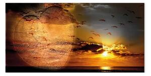 Quadro Tramonto tra le nuvole - uccelli su sfondo rosso del cielo
