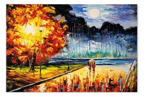 Quadro moderno Passeggiata serale - innamorati in un parco colorato d'autunno