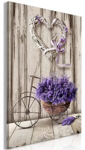 Bouquet segreto di lavanda - fiori in vaso a forma di bicicletta su sfondo di legno