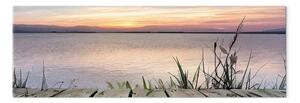 Quadro su tela Lago al tramonto - canneti sullo sfondo di acque calme e montagne