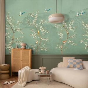 Carta da parati Alberi in fiore - uccelli sopra fiori bianchi su sfondo verde