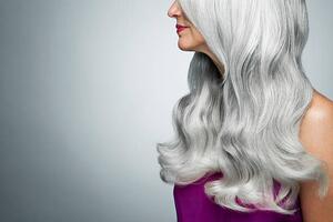 Fotografia artistica Cropped profile of a woman with long gray hair, Andreas Kuehn, (40 x 26.7 cm)