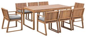 Set da pranzo da giardino 9 pezzi in legno di acacia chiaro 8 sedie con cuscini di seduta grigio chiaro Beliani