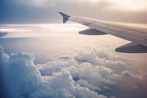 Illustrazione Image of airplane wing flying above the clouds, Moazzam Ali Brohi