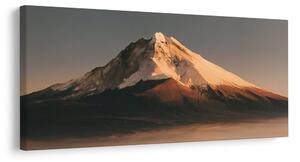 Quadro su tela – Montagna innevata nella luce dorata