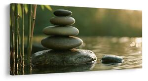 Quadro su tela – Equilibrio di pietre accanto al bambù