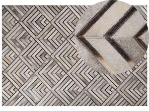 Tappeto in pelle di vacchetta Patchwork in pelle beige Motivo geometrico a rombi 160 x 230 cm Beliani