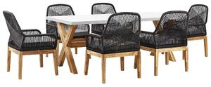 Set da esterno con tavolo in fibra di cemento grigio e 6 sedie in vimini stile moderno industriale Beliani