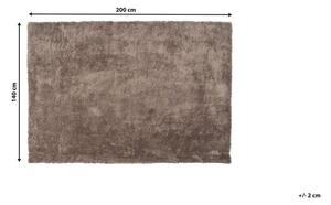 Tappeto Shaggy in cotone marrone chiaro in misto poliestere 140 x 200 cm soffice pelo denso Beliani