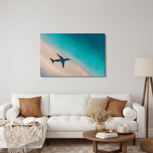 Quadro su tela – Spiaggia e ombra di un aereo