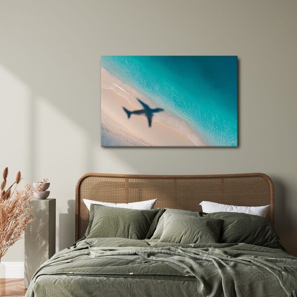 Quadro su tela – Spiaggia e ombra di un aereo