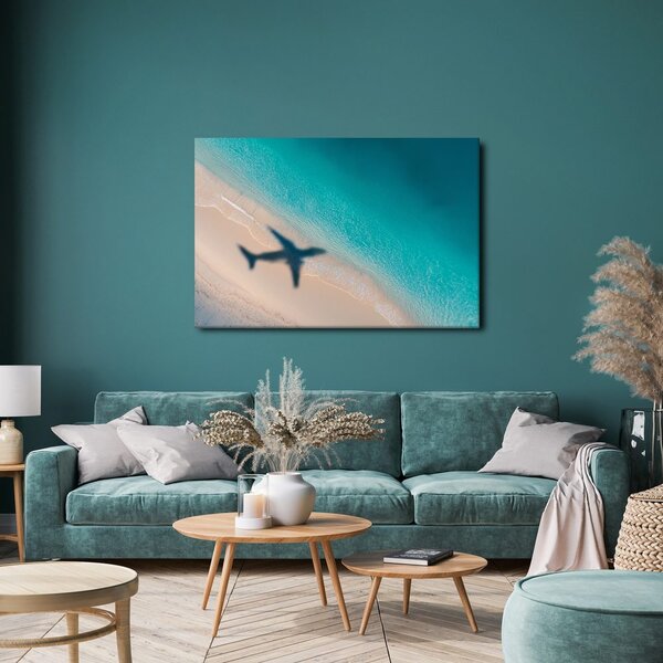 Quadro su tela – Spiaggia e ombra di un aereo