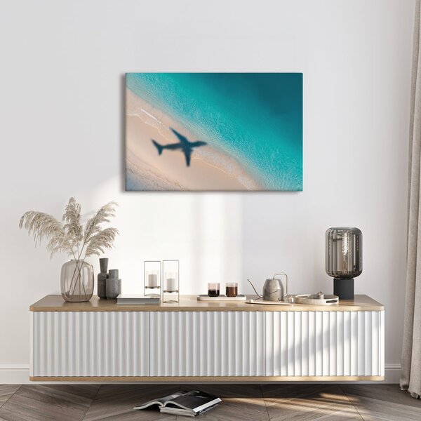 Quadro su tela – Spiaggia e ombra di un aereo
