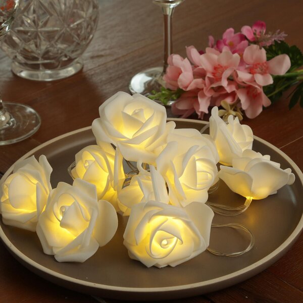 Catena luminosa a LED a forma di rosa - 10 rose luminose - Timer integrato - Alimentazione a batteria - Lunghezza: 1,8 metri - Per uso interno - Colore: bianco
