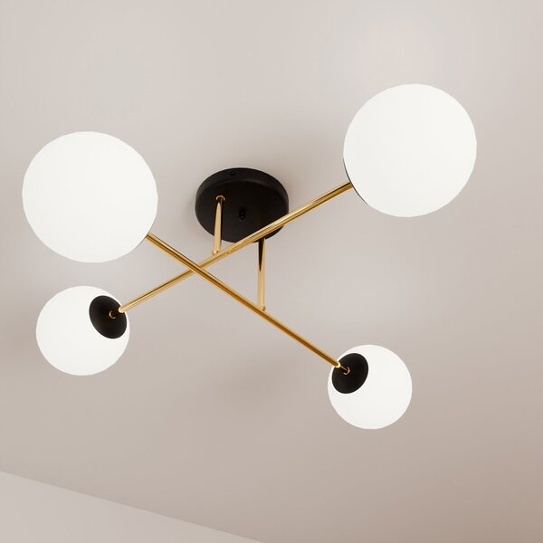 Plafoniera Moderna Magnium 4 Luci In Acciao Nero Oro Sfere In Vetro Bianco