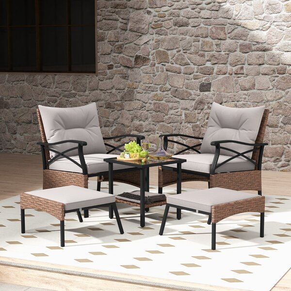 Costway Set di 5 mobili da giardino in rattan, Sedie da esterno con poggiapiedi cuscini e tavolino in vetro temperato Marrone