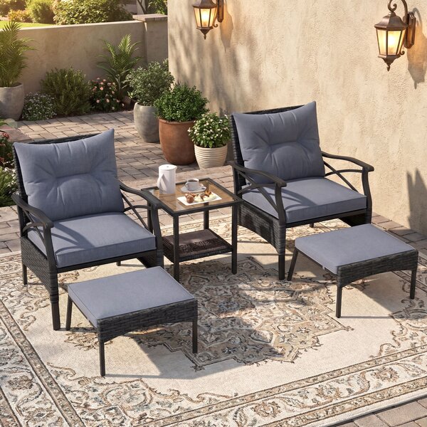 Costway Set di mobili da giardino in rattan a 5 pezzi con sedie e poggiapiedi esterni, Tavolino in vetro temperato a 2 livelli con cuscini per portico e balcone Nero