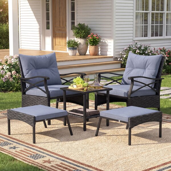 Costway Set di mobili da giardino in rattan a 5 pezzi con sedie e poggiapiedi esterni, Tavolino in vetro temperato a 2 livelli con cuscini per portico e balcone Nero