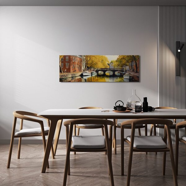 Quadro su tela – Foglie autunnali dorate sopra il canale