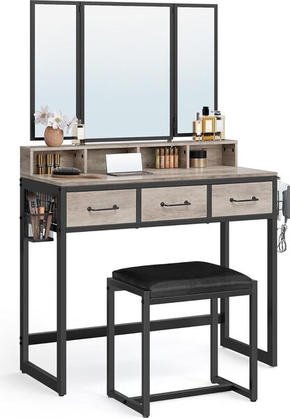 VASAGLE, tavolino da toilette con specchio pieghevole in 3 parti, supporto per asciugacapelli, tavolino per cosmetici con sgabello imbottito, 3 cassetti, design industriale, grigio e