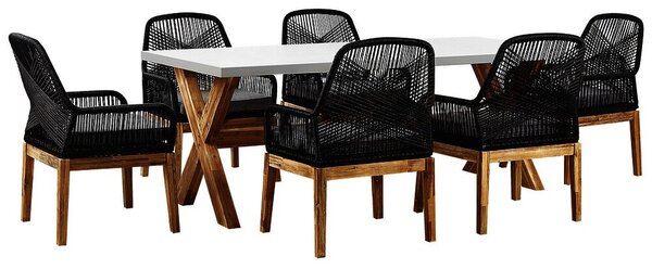 Set da esterno con tavolo in fibra di cemento grigio e 6 sedie in vimini Beliani