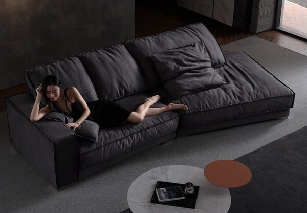 Divano angolare moderno a forma di L, con tessuto imbottito e funzione letto