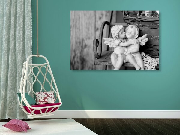 Quadro su tela – Statuette di angioletti sulla panchina in bianco e nero