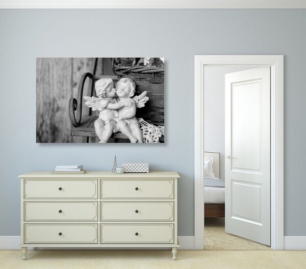 Quadro su tela – Statuette di angioletti sulla panchina in bianco e nero