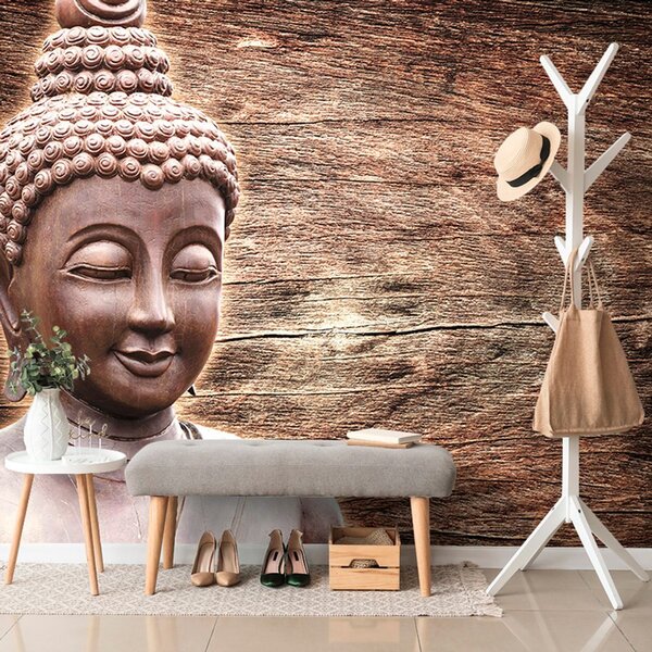 Carta da parati – Statua di Buddha su sfondo di legno