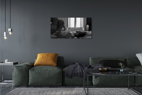 Quadro su tela Donna bugiarda che guarda la finestra 100x50 cm