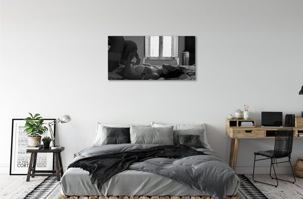 Quadro su tela Donna bugiarda che guarda la finestra 100x50 cm