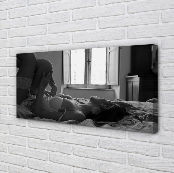 Quadro su tela Donna bugiarda che guarda la finestra 100x50 cm