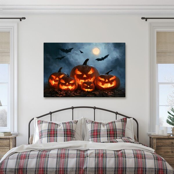 Quadro su tela – Zucche di Halloween sotto i pipistrelli