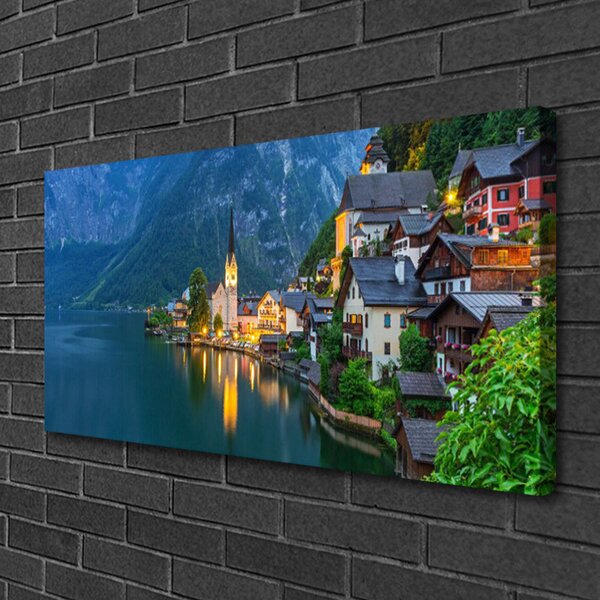 Quadro su tela Città di montagna di notte sul lago 100x50 cm