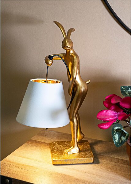Lampada da tavolo in resina dorata a forma di coniglio Dimensioni 26x16xh 47 cm in resina dorata e paralume in tessuto bianco