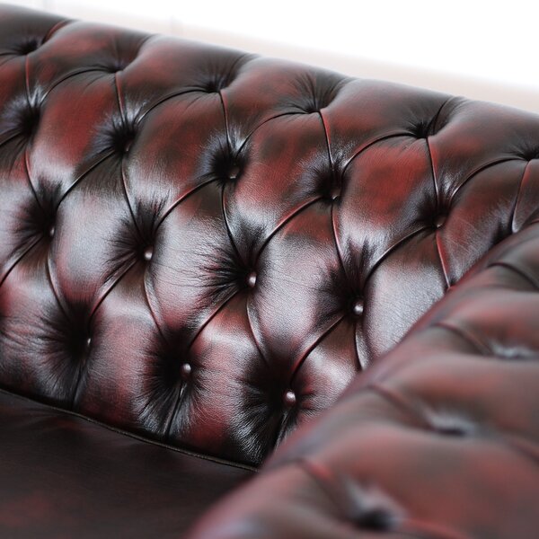 Divano Chesterfield pelle fiore bordeaux stile old America rifinita a mano