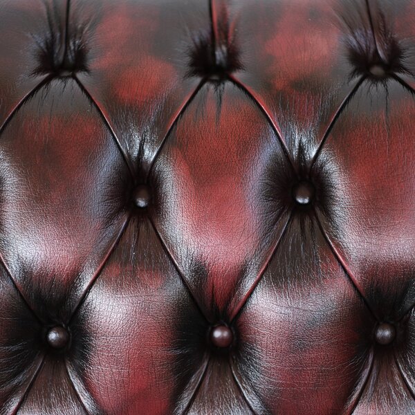 Divano Chesterfield pelle fiore bordeaux stile old America rifinita a mano