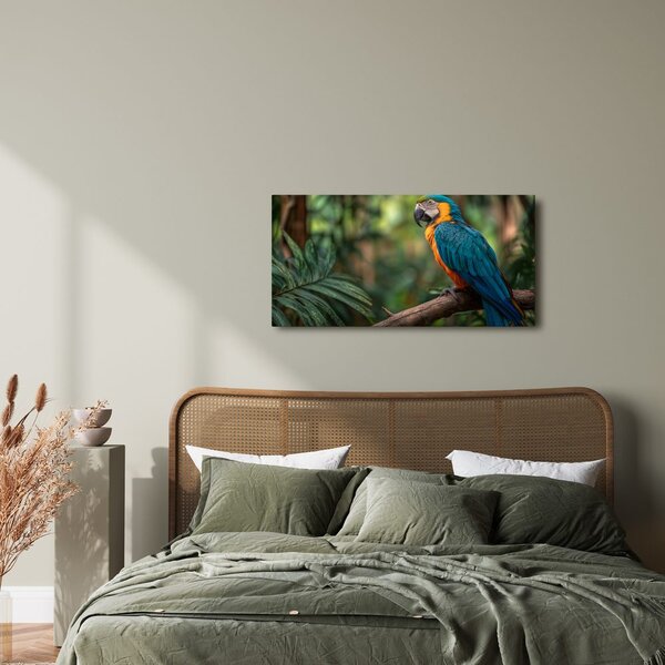 Quadro su tela – Pappagallo tra foglie tropicali