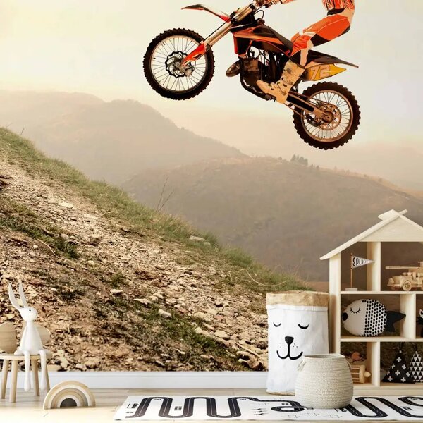 Carta da parati Sport motoristico - motociclista su motocross con paesaggio montano sullo sfondo